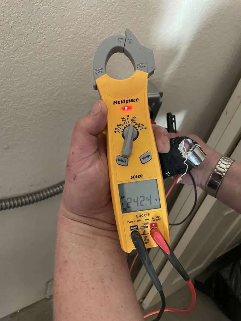 Voltage testing with clamp meter during Hot Tub / Pool Electrical Wiring in Victor